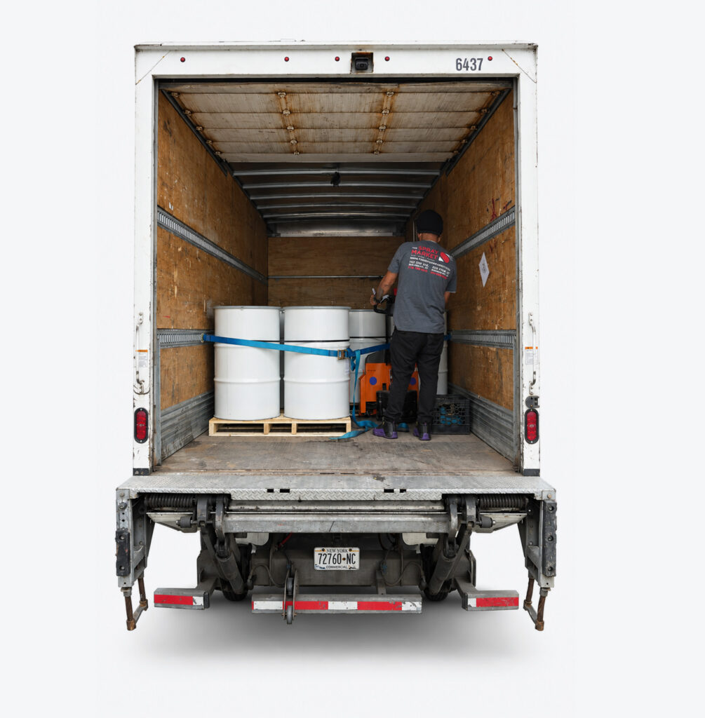 Spray Market truck loaded with drums for delivery