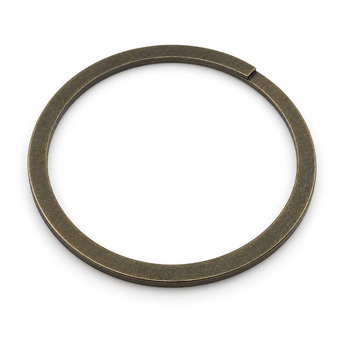 Close-up of a spiral retaining ring used in mechanical assemblies.